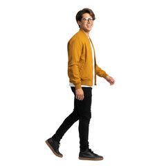 Naklejka premium Smiling Hispanic man walks confidently in modern city style, cutout isolated on a transparent background