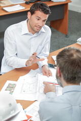 architect making a point in the office