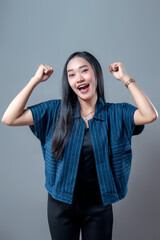 Happy Asian Woman Celebrating With Raised Fists