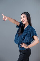 Smiling Asian Woman Pointing Forward With Confidence