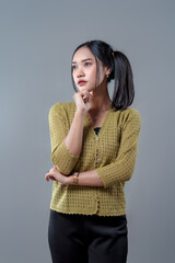 Thoughtful Asian Woman in Professional Pose