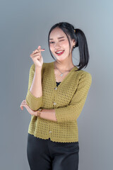 Playful Asian Woman Making Finger Heart Gesture