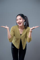 Cheerful Asian Woman Shrugging with Open Palms