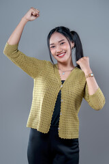 Confident Asian Woman Showing Strength Gesture