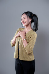Indonesian Woman Smiling with Hands on Chest