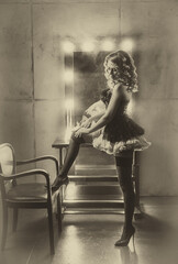 art sepia black and white color, happy retro lady puts on stockings on legs. high heels shoes short dress. sexy woman smiling face burlesque show. flapper girl 20s roaring twenties nostalgia old style