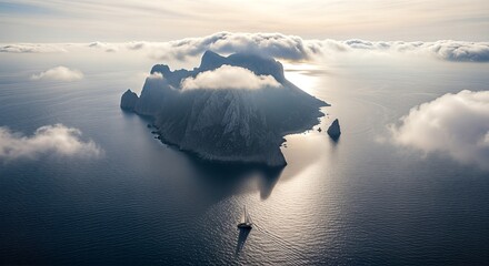 Dramatic Aerial View of a Mystical Island Mountain Peak Emerging Through Sea Fog at Sunset
