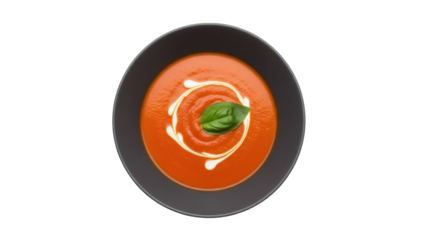 Tomato soup in a dark bowl isolated PNG on transparent background, creamy swirl and basil leaf garnish for food design