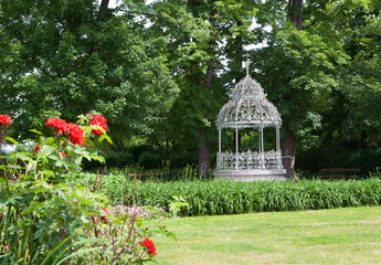 Ornate gazebo in lush garden at Die Grosse Zisterne, Graz, Styria