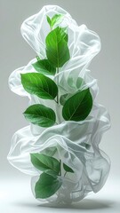 Plant sprouts from wispy white fabric