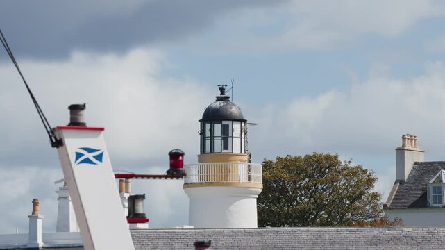 Scottish Lighthouse Rotating Beacon Against Cloudy Cromarty Sky