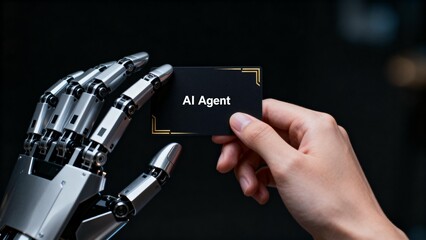 Human hand and robotic hand holding card