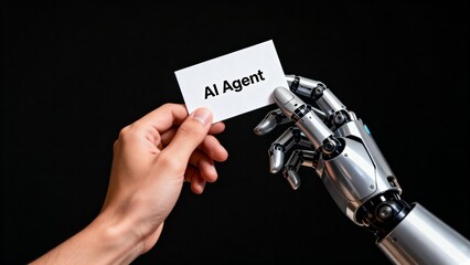 Human hand and robotic hand holding card