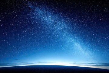 Obraz premium Night sky with brilliant Milky Way galaxy shining over dark horizon