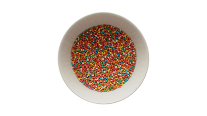 Vibrant candy beads in white bowl on black background