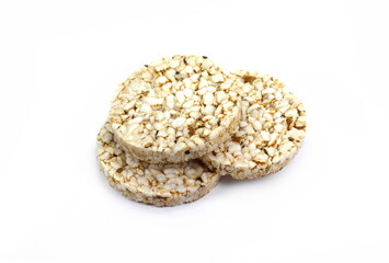 Puffed rice cakes isolated on white. Stack of puffed whole grain crispbread isolated on white.