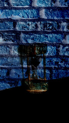 wull background with a glass of water