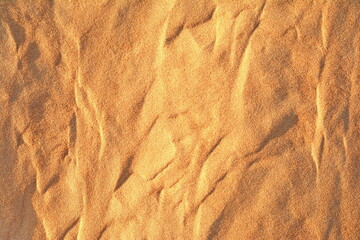 Desert Dune Texture Close Up. Sand texture. Desert surface detail. Abstract background. Sand dune texture . Shifting sand fines in the wind. Sunlit Sand Texture with Soft Waves 