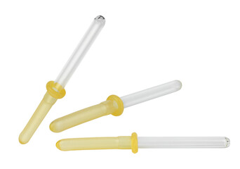Obraz premium clean studio photograph of three glass droppers with amber-tinted tips against a black backdrop, perfect for highlighting cosmetic, pharmaceutical, and aromatherapy items