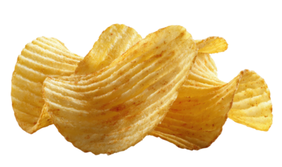 Stacked, ruffled potato chips with visible ridges against a black background