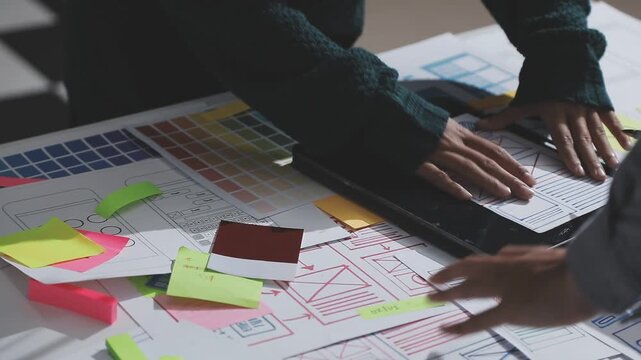 UXUI design brainstorming session with sketches and digital tools