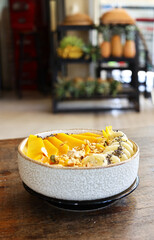 Smoothie bowl with fresh fruit and granola, healthy eating