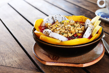 Smoothie bowl with fresh fruit and granola, healthy eating