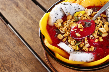 Smoothie bowl with fresh fruit and granola, healthy eating