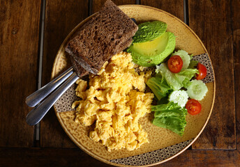 traditional breakfast with fried egg and salad