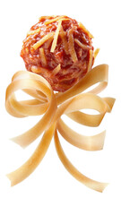 Meatball with shredded cheese, pasta ribbons as bow, dark background