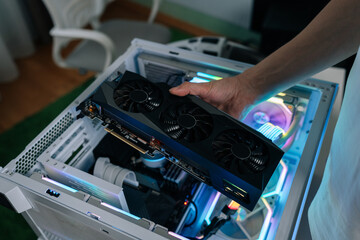 Hands of computer technician using screwdriver to assemble and service internal components of desktop pc, performing maintenance and upgrade tasks on hardware. Concept of desktop PC service.