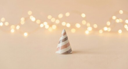 Festive striped party hat against a soft bokeh light background