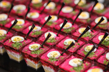 Beetroot layered salad shots with quail egg