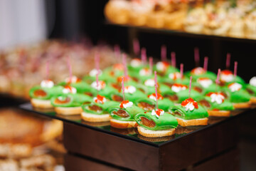 Green salmon canapes on catering tray