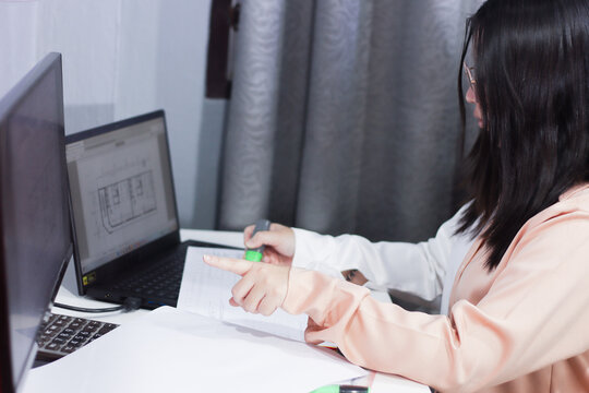 Female QS Engineer Checking Structural Blueprint