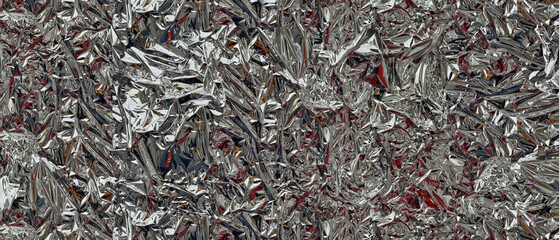 Textured high-gloss surface of crumpled silver foil. Metallic reflections and deep creases create dynamic futuristic backdrop perfect for abstract backgrounds and modern designs