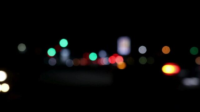 Blurred Vehicle Lights in Traffic, Urban Night Motion Background
Video footage of blurred vehicle lights moving in traffic, creating dynamic light trails and soft bokeh effect. This clip represents ur