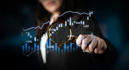 A businesswoman is analyzing stock market data, showcasing growth trends and analytical insights. The digital graphs represent investment strategies and financial future. Scalp