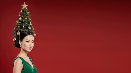 Photorealistic portrait of a asian woman in a bright green dress, evening makeup, and a high cone hairstyle styled as a Christmas tree with ornaments, garlands, glowing star on top, soft frontal ligh