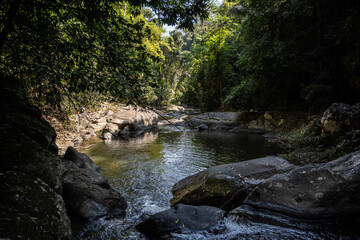 Obraz premium A mountain river and waterfall in a wild forest in the Hua Hin region of Thailand.