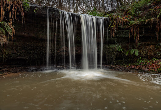 High weald woodland waterfall near Crowhurst east Sussex south east England UK