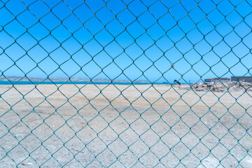 Colorful colonial buildings in Lüderitz, a small coastal town in Namibia, facing the Atlantic Ocean. Historic German architecture contrasts with desert landscapes, harbor views. © coffeinlix 
