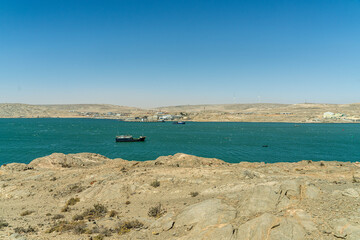 Colorful colonial buildings in Lüderitz, a small coastal town in Namibia, facing the Atlantic Ocean. Historic German architecture contrasts with desert landscapes, harbor views. © coffeinlix 