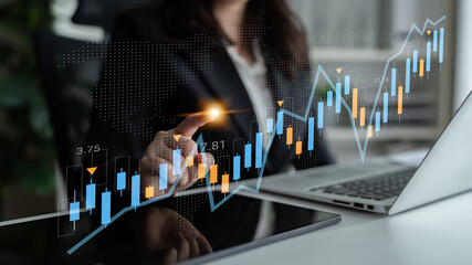 A business professional analyzes financial data trends on a digital interface. This image illustrates market growth strategies through dynamic graphs and charts. Gantry