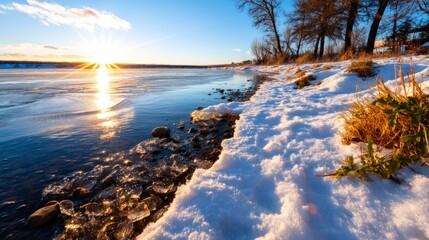 Serene Winter Landscape with Lakeshore and Frozen Surface at Sunset