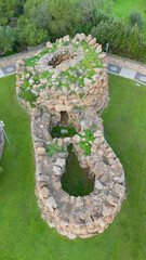 Ancient Nuraghe Arresi prehistoric stone tower in Sardinia aerial archaeological landscape