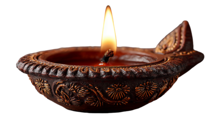 Traditional Indian clay lamp with flame on black background