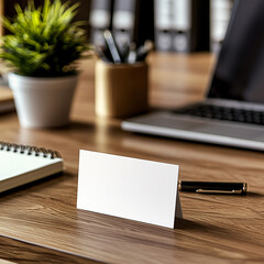 Office desk scene featuring notepad blank card and pen in a modern workspace environment close-up view professional setting