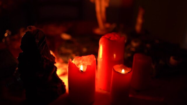 Esoteric ritual table with burning candles, mystical atmosphere, occult symbols and magical objects used for spiritual practices.