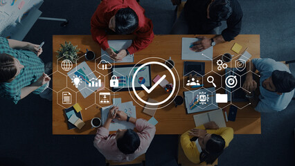 A diverse group collaborates on innovative digital solutions in a modern workspace, surrounded by icons representing technology, teamwork, and success. Gantry